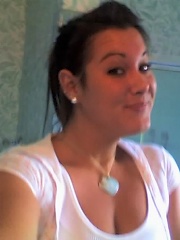plain looking girl with big head plays with new camera